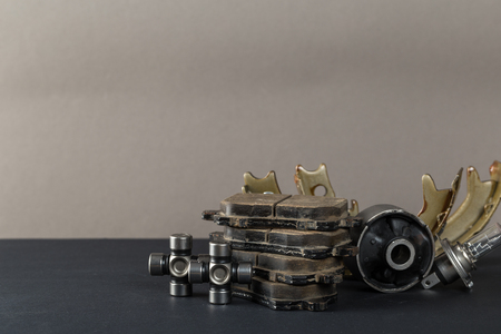 New car parts on a gray background closeup. Shop for auto