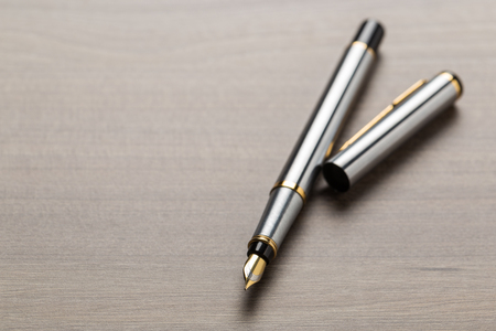 fountain pen on wooden tableの写真素材