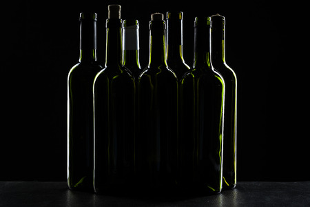 Template concept many wine bottle for your design and advertising company promotion your of product on black background with copy space. Wine bottle mockup.の写真素材