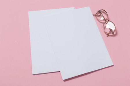 top view of a open notebook on a pink background. Office notepad flat layの写真素材