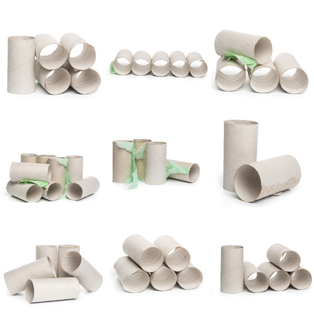 A selection of cardboard toilet paper tubes in various arrangements isolated on a white background. Large photograph, high resolutionの写真素材