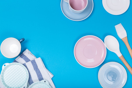 Clean dishes, coffee or tea set. Plenty of elegant porcelain cups and saucers at blue background.top view and flat lay.の写真素材