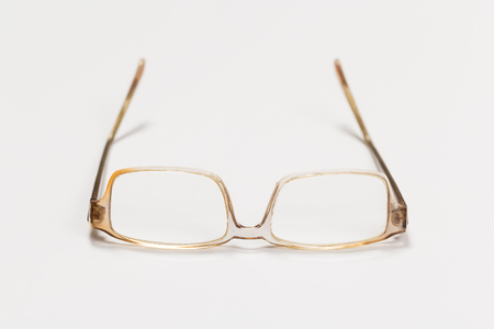 Front view of reading glasses with tortoiseshell frames on white backgroundの写真素材
