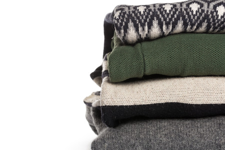 different knitted sweaters on a isolated backgroundの写真素材