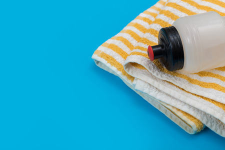 Sport equipment on blue background, top view. Concept healthy lifestyle, healthy food, sport and diet.の写真素材