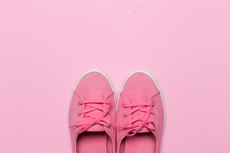 Pink shoes on a pastel background. Top view. Free space for text.の写真素材