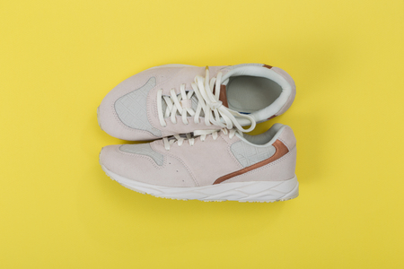 Overhead Shot Of White Sneakers On paper Pink Backgroundの写真素材