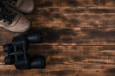 Overhead view of travel equipment for a backpacking trip on wooden floor.  Time to travel concept.の写真素材