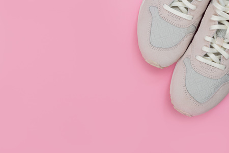 Overhead Shot Of White Sneakers On paper Pink Backgroundの写真素材