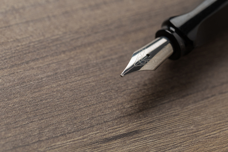 Black fountain pen on tableの写真素材