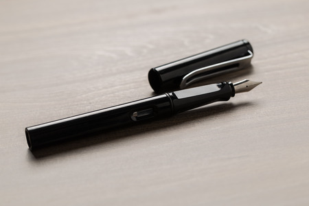 Black fountain pen on tableの写真素材