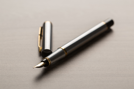 fountain pen on wooden tableの写真素材