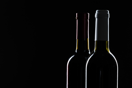 Template concept two wine bottle for your design and advertising company promotion your of product on black background with copy space. Wine bottle mockup.の写真素材