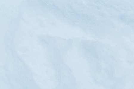 Winter snow. Snow texture Top view of the snow. Texture for design. Snowy white texture. Snowflakes.