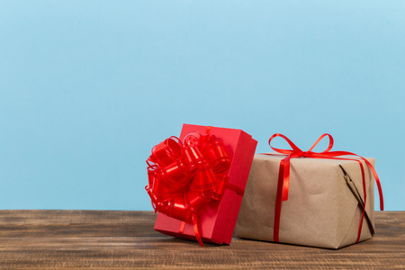 Festive gift box on blue background. Festive greeting card.の写真素材