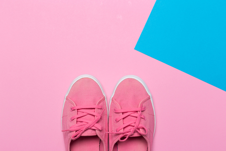 Pink shoes on a pastel background. Top view. Free space for text.の写真素材