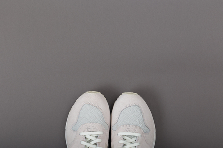Overhead Shot Of White Sneakers On paper Pink Backgroundの写真素材