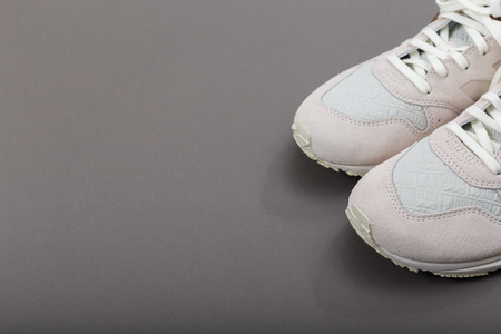 Overhead Shot Of White Sneakers On paper Pink Backgroundの写真素材