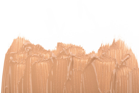Close up of smear beige and ligth pink tone foundation texture for background.の写真素材