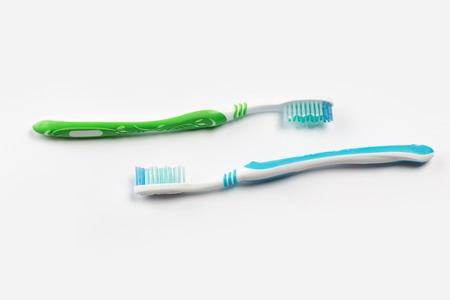two new toothbrush on white background. dental conceptの写真素材
