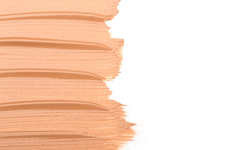 Close up of smear beige and ligth pink tone foundation texture for background.の写真素材