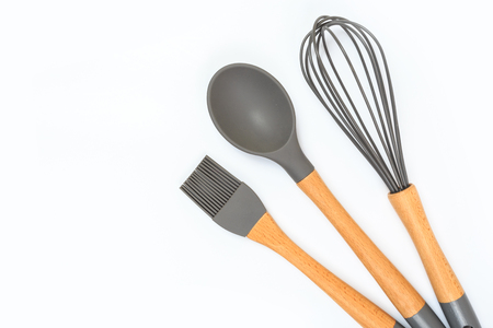 Set of kitchen utensils with wooden handles isolated on white backgroundの写真素材