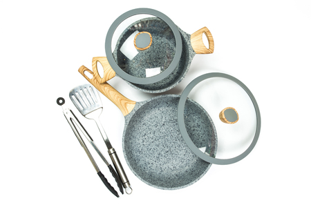 Photo of a ceramic frying pan with a lid and pans with a lid isolated on a white background. Studio shotの写真素材