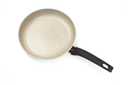 Photo of a bright ceramic pan with a black handle, isolated on a white background. Studio shotの写真素材