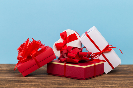 Festive gift box on blue background. Festive greeting card.の写真素材
