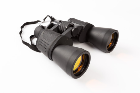 Black binoculars with orange lens isolated on white backgroundの写真素材