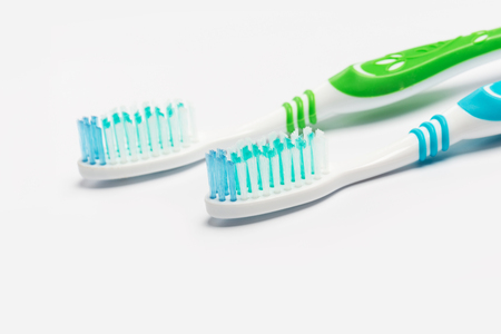 New different colored toothbrushes on a white backgroundの写真素材