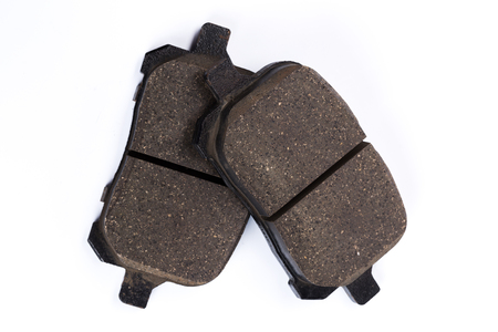 Set of old brake pads, car spares isolated on white backgroundの写真素材