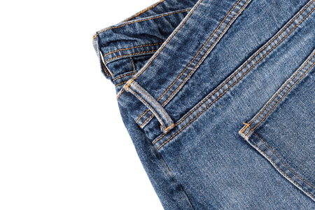 stack of various shades of blue jeans on white backgroundの写真素材
