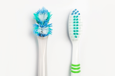The old toothbrush and new toothbrush on a white background.の写真素材