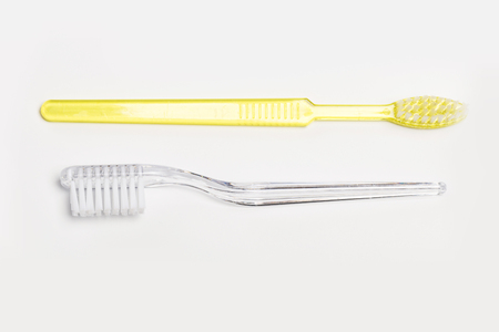 New different colored toothbrushes on a white backgroundの写真素材