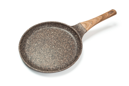 Photo of a ceramic frying pan with a wooden handle isolated on a white background.の写真素材