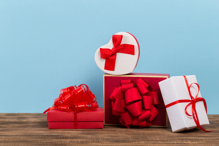 Festive gift box on blue background. Festive greeting card.の写真素材