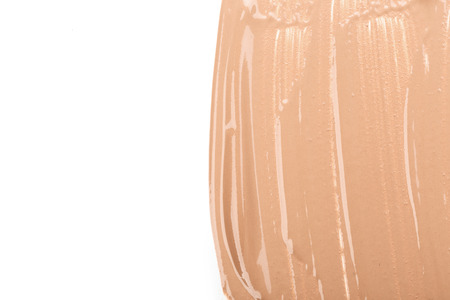 Close up of smear beige and ligth pink tone foundation texture for background.の写真素材