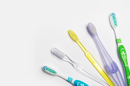 New different colored toothbrushes on a white backgroundの写真素材