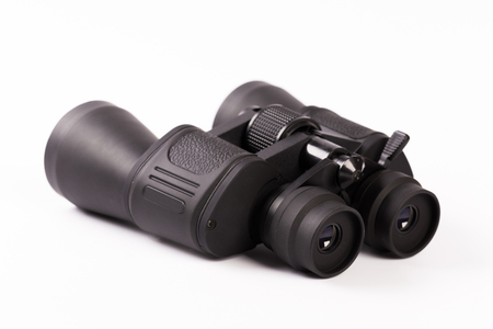 Black binoculars with orange lens isolated on white backgroundの写真素材