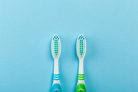 Two new toothbrush on a blue background. Dental conceptの写真素材