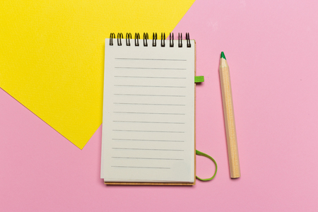 open notebook with pencil on a gray background. Office notepad flat lay. Top view with copy spaceの写真素材
