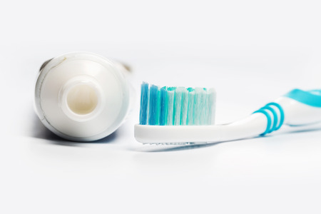 Flat lay composition with manual toothbrushes on white background.