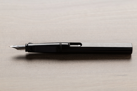 Black fountain pen on tableの写真素材