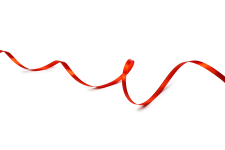 Red satin ribbon isolated on white backgroungの写真素材
