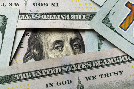 American dollars. A stack of hundred dollar bills. Close up of new hundred dollar bill on the white background.の写真素材