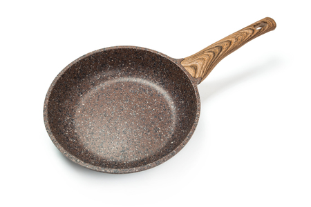 Photo of a ceramic frying pan with a wooden handle isolated on a white background.の写真素材