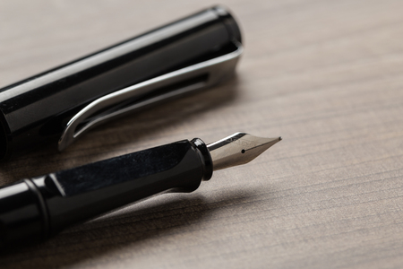 Black fountain pen on tableの写真素材