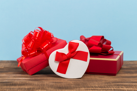 Festive gift box on blue background. Festive greeting card.の写真素材