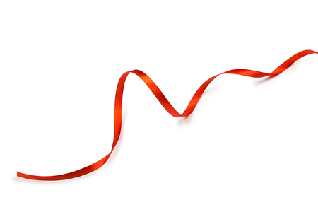 Red satin ribbon isolated on white backgroungの写真素材
